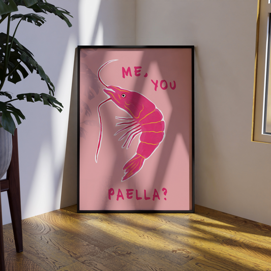 Framed artwork with a pink shrimp illustration and text on a wall.